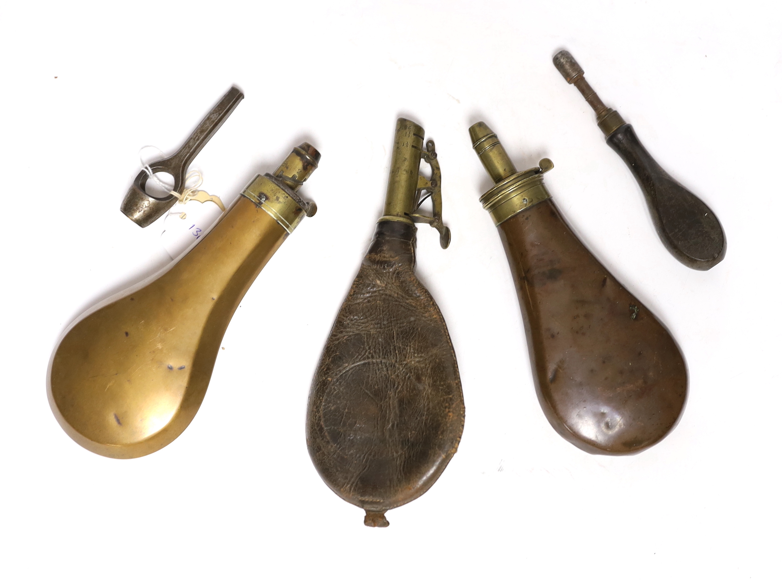 Two copper powder flasks, a leather powder flask and two other items (5)